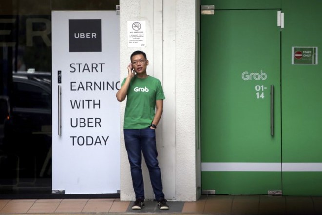 Thương vụ Grab mua Uber có khả năng bị cơ quan chức năng Singapore yêu cầu hủy bỏ . Ảnh: CNA.
