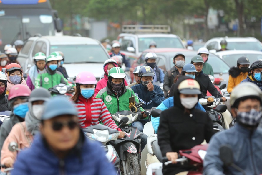 Người dân Hà Nội chịu nhiều tác động xấu từ ô nhiễm không khí Ảnh: Nhật Minh