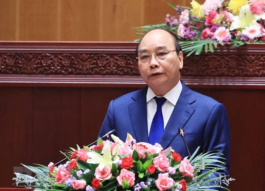 Chủ tịch nước Nguyễn Xuân Phúc phát biểu tại Kỳ họp lần thứ nhất, Quốc hội Lào khóa IX. (Ảnh: Thống Nhất/TTXVN) 