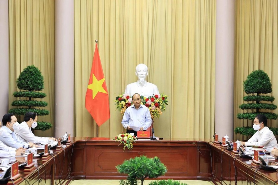 Chủ tịch nước gặp mặt các điển hình tiên tiến trong thực hiện mục tiêu kép của ngành dệt may Việt Nam. Ảnh VGP