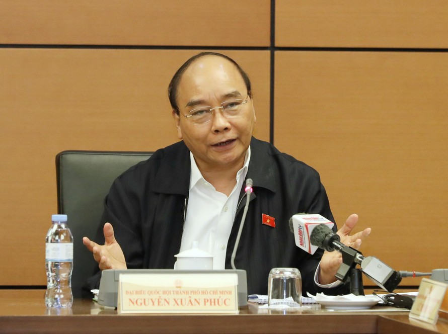 Chủ tịch nước Nguyễn Xuân Phúc phát biểu tại phiên thảo luận ở tổ. Ảnh Như Ý