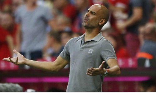 Guardiola nhận thất bại trước đội bóng cũ Bayern. Ảnh: Reuters.