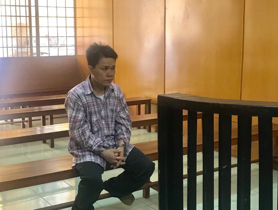 Huỳnh Văn Tuấn tại tòa ngày 12/7. Ảnh: Tân Châu