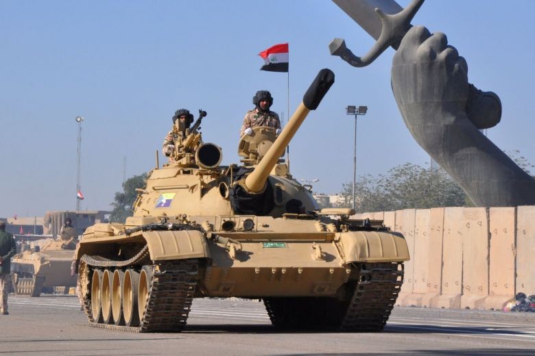 Xe tăng của quân đội Iraq tham gia diễu binh hôm qua, 10/12 tại thủ đô Baghdad. Ảnh: Reuters