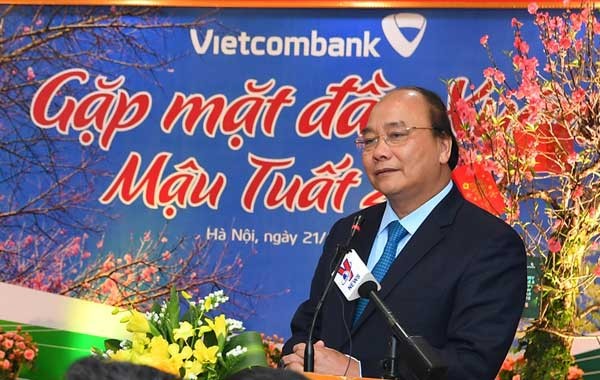 Đồng chí Nguyễn Xuân Phúc - Uỷ viên Bộ Chính trị, Thủ tướng Chính phủ phát biểu chúc Tết tập thể lãnh đạo và cán bộ nhân viên Vietcombank
