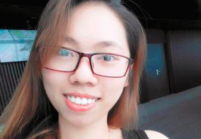 Lại Thị Kiều Trang bị bắt giữ vì là nghi phạm trong vụ đầu độc bằng trà sữa - Ảnh: Hoàng Long