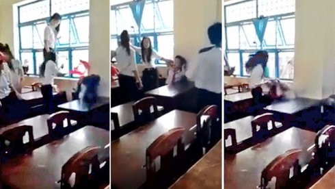 Nhóm nữ sinh hung hăng đánh em P. trong khi P. bị cô lập trong góc tường lớp học - Ảnh cắt từ video clip