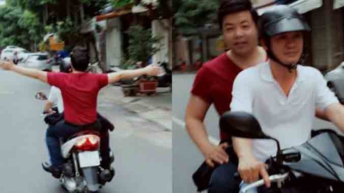 Quang Lê với hình ảnh không đội mũ bảo hiểm khi ngồi trên xe máy.