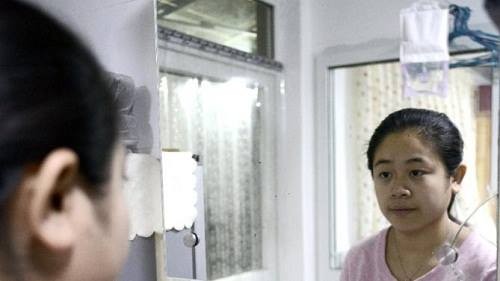 Li Xue là một trong hàng triệu đứa con thứ hai ở Trung Quốc chịu phận chui nhủi vì gia đình vi phạm chính sách kế hoạch hóa gia đình. Ảnh: AFP.