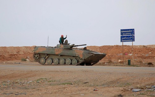 Xe tăng của lực lượng ủng hộ Chính phủ Syria. Ảnh: AFP/TTXVN.