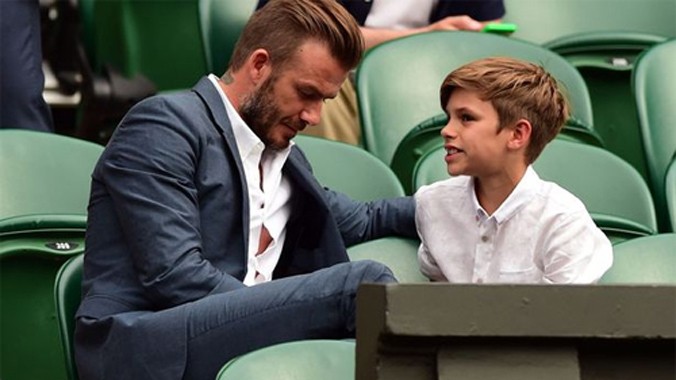 Beckham và con trai Romeo. Ảnh: Reuters