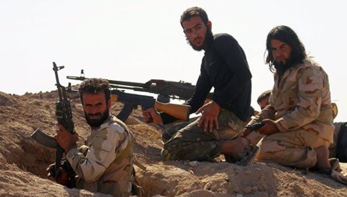Các binh sĩ phe đối lập tại Syria. Ảnh Reuters.