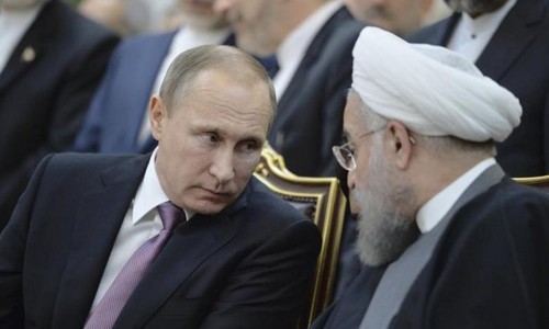 Tổng thống Nga Vladimir Putin (trái) và Tổng thống Iran Hassan Rouhani. Ảnh: Reuters.