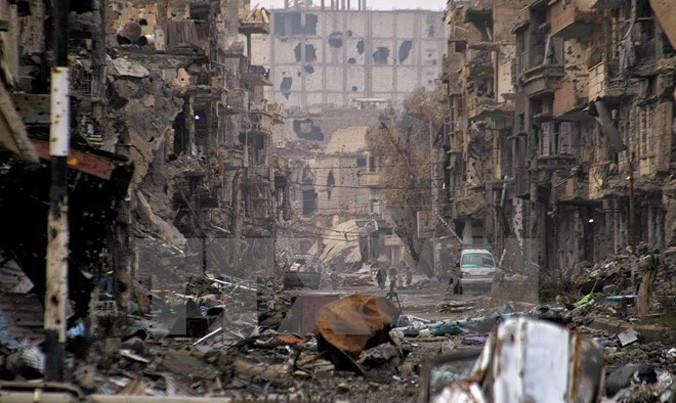Cảnh đổ nát tại Deir al-Zor, Syria sau các cuộc không kích. Nguồn: REUTERS/TTXVN.