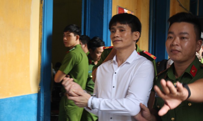 Nguyễn Mình Tâm – kẻ giết con ruột mình rồi phi tang tại phiên tòa sáng 7/6. Ảnh: Tân Châu.