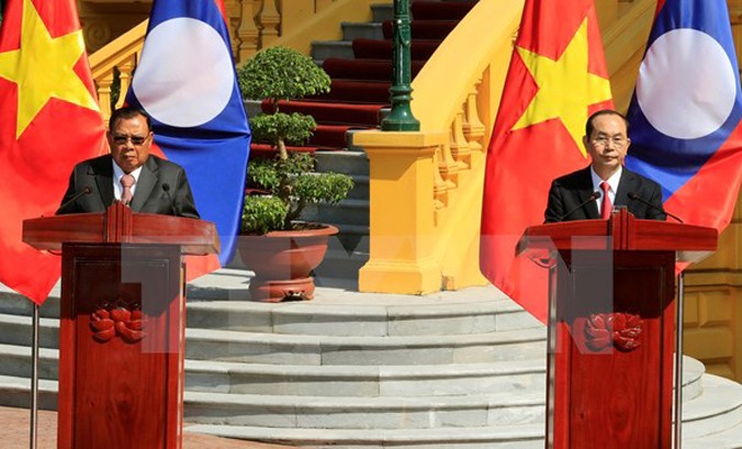Chủ tịch nước Trần Đại Quang và Tổng Bí thư, Chủ tịch nước Lào Bounnhang Vorachith đồng chủ trì buổi họp báo kết thúc Năm đoàn kết hữu nghị Việt Nam-Lào, Lào-Việt Nam. Ảnh: Nhan Sáng/TTXVN.