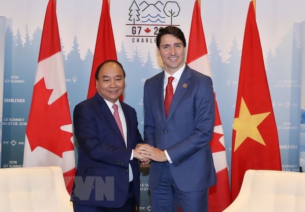 Thủ tướng Nguyễn Xuân Phúc và Thủ tướng Canada Justin Trudeau. Ảnh: Thống Nhất/TTXVN.