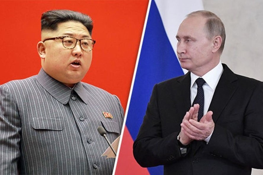 Ông Putin (phải) xác nhận mời Kim Jong Un tới Nga. Ảnh: Express.