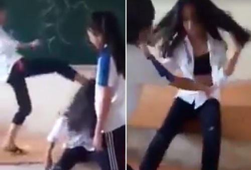 Năm nữ sinh lớp 7 trường THCS Trường Yên (Chương Mỹ, Hà Nội) đã đánh hội đồng, phanh áo một bạn nữ tại lớp học. Ảnh cắt từ clip.