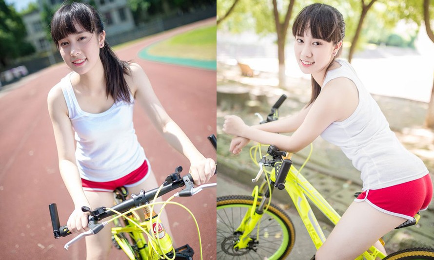 Thiếu nữ đẹp rạng rỡ bên xe đạp thể thao
