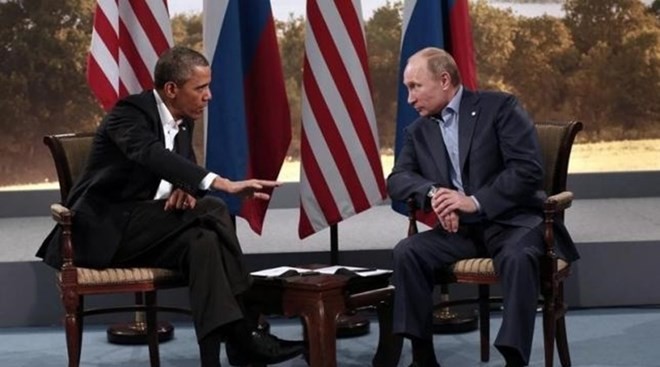 Tổng thống Mỹ Obama (trái) và đánh giá người đồng cấp Nga Putin. (Nguồn: AFP)