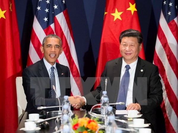 Tổng thống Mỹ Barack Obama (trái) và Chủ tịch Trung Quốc Tập Cận Bình trong cuộc hội đàm bên lề Hội nghị COP 21. (Nguồn: THX/TTXVN)