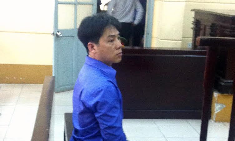 Đặng Văn Tuấn tại phiên tòa sáng nay 24/8. Ảnh: Tân Châu