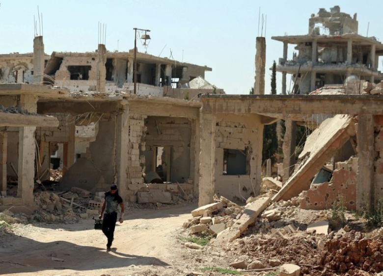 Thành phố Deraa, Syria, không xung đột vào ngày 9/7 sau lệnh ngừng bắn. Ảnh: Reuters