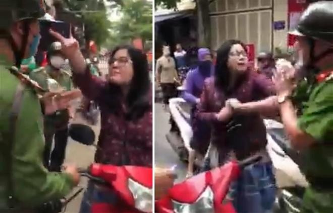 Người phụ nữ chửi bới, tấn công tổ công tác Công an phường Giáp Bát sau khi bị yêu cầu kiểm tra hành chính vì vi phạm giao thông. Ảnh cắt từ clip