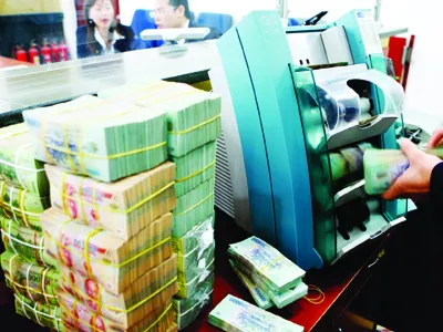 Nhiều ngân hàng không thực hiện được việc giảm tỷ lệ cho vay phi sản xuất xuống 22% vào 30-6 Ảnh: Hồng Vĩnh