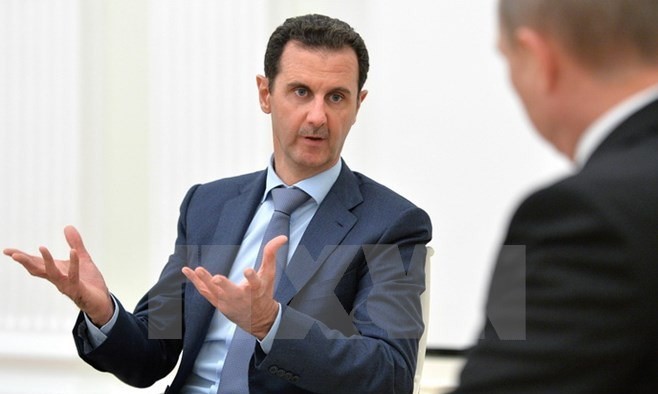 Tổng thống Syria Bashar al-Assad (trái) trong cuộc gặp với Tổng thống Nga Vladimir Putin (phải) tại thủ đô Moskva, Nga ngày 21/10. (Nguồn: AFP/TTXVN)